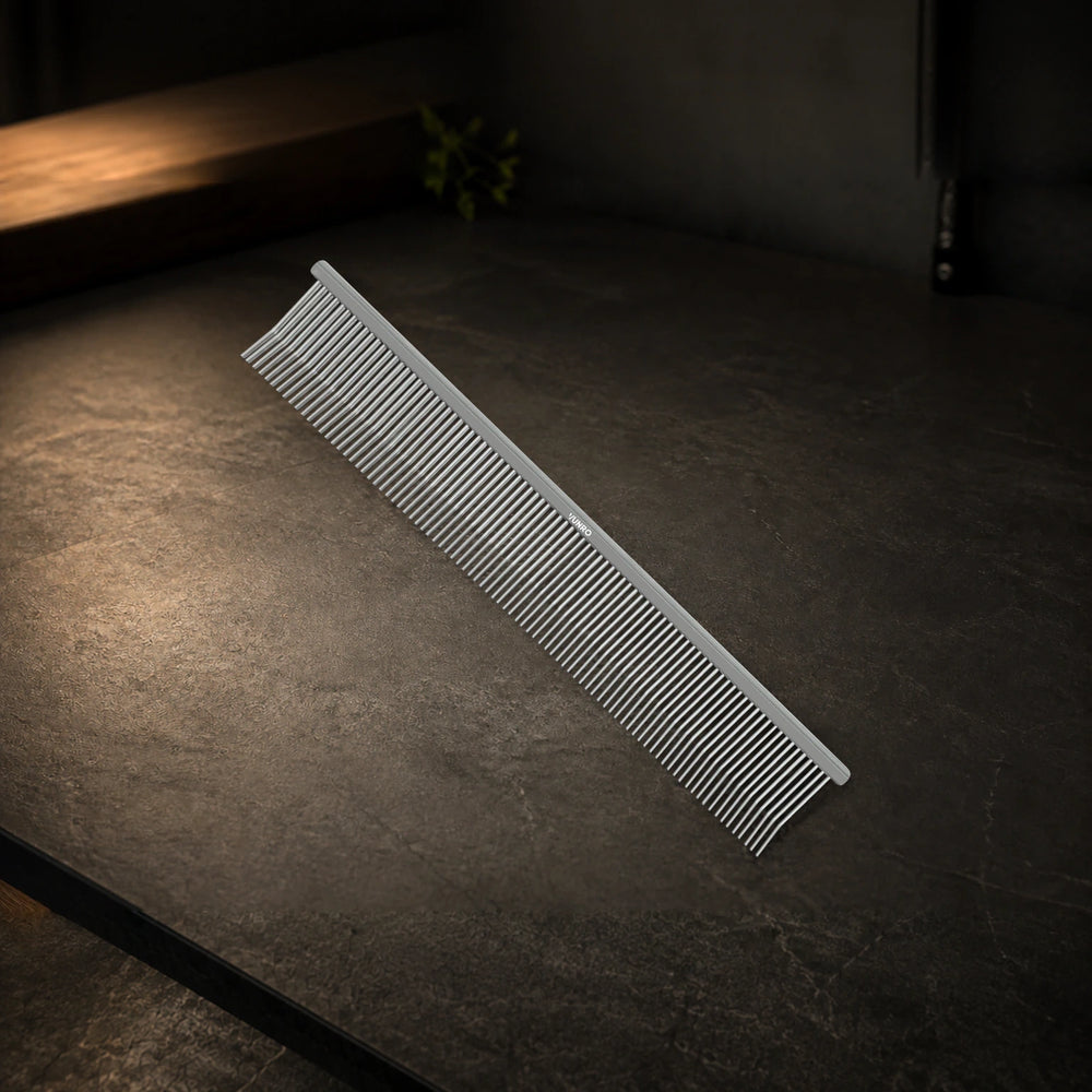 8.5" Angled Pin Detangling and Finishing Comb photographed on the VUNRO professional workbench