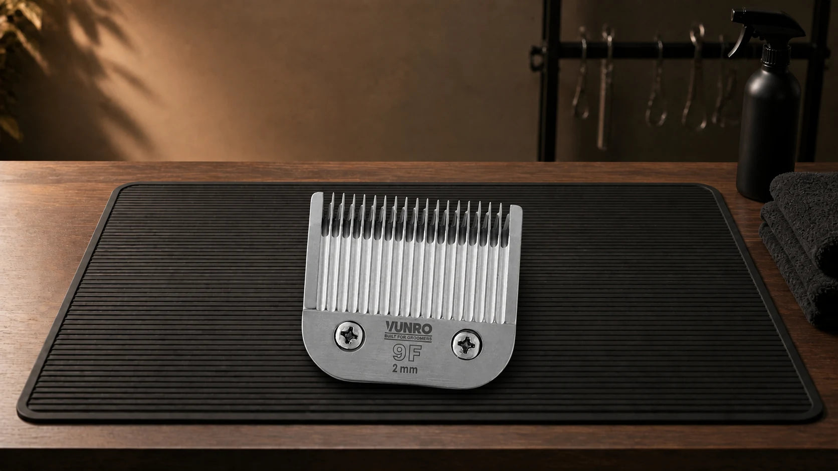 #9F Dog Clipper Blade (2 mm) resting naturally on the VUNRO grooming workbench